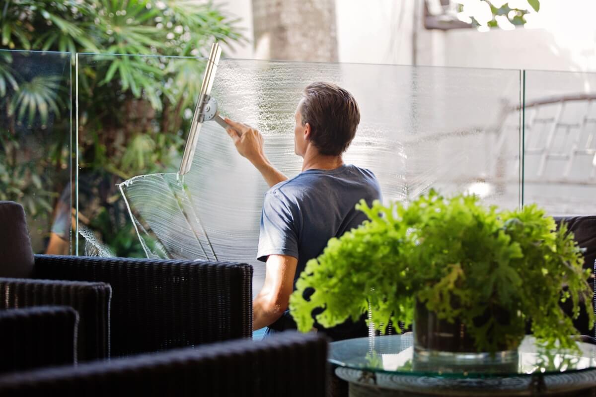 a man cleaning a window