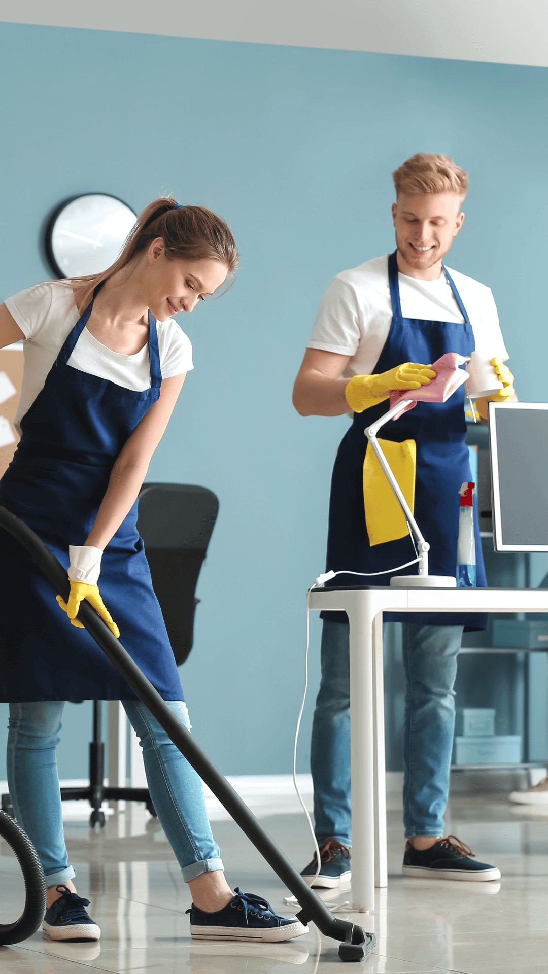 two people cleaning an office building